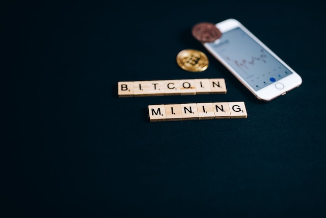 Photo by Leeloo Thefirst: https://www.pexels.com/photo/bitcoin-mining-letter-tiles-near-an-iphone-8358036/