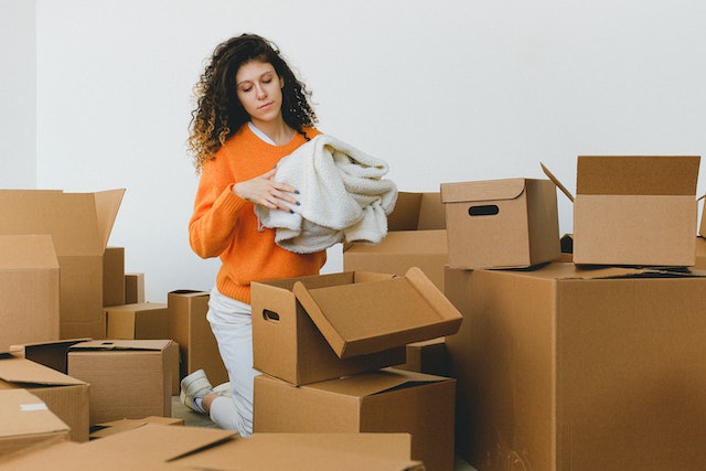 Photo by SHVETS production: https://www.pexels.com/photo/focused-young-relocating-female-packing-belonging-into-cardboard-boxes-7203815/